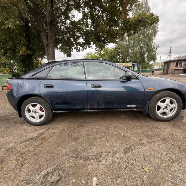 Mazda 323 1998 - 9