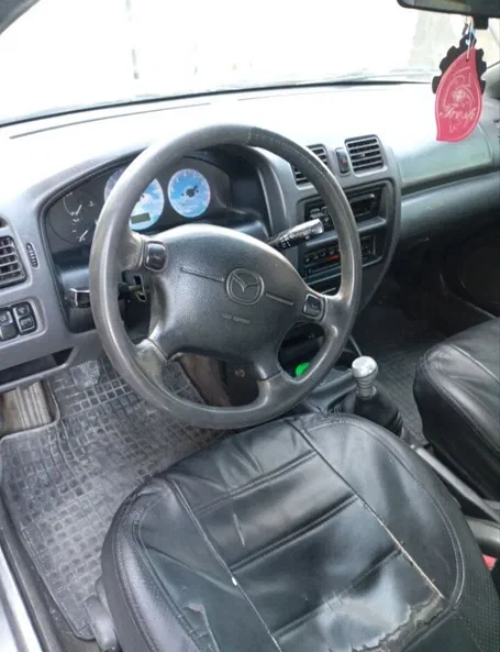 Mazda 323 1997 - 9